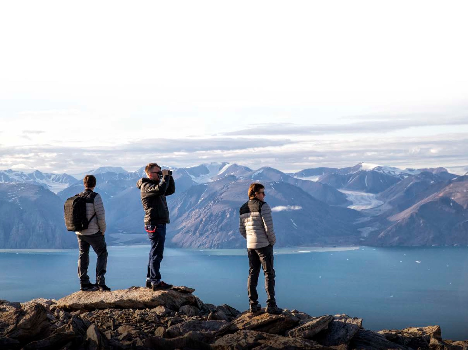 EYOS expedition team taking in a fjord view